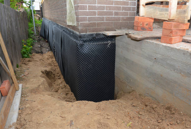 Happy homeowners after waterproofing job in Grand Ledge